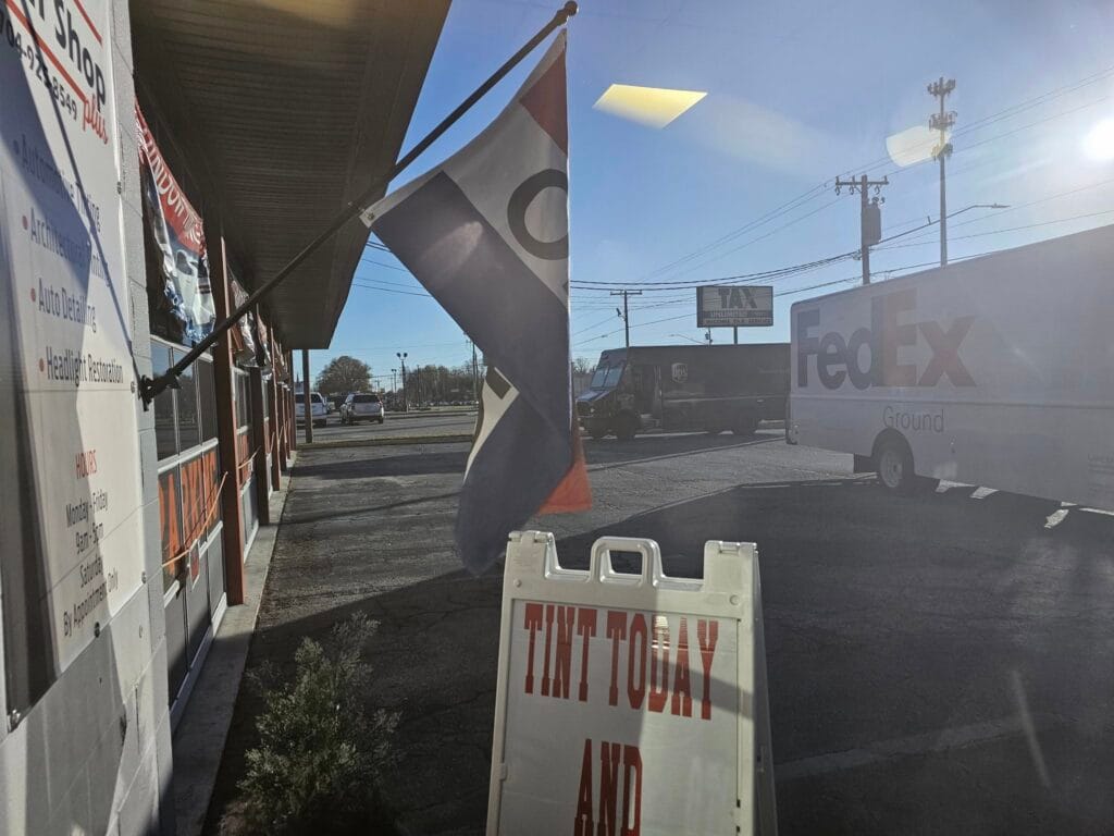 The Tint Shop location with vans parked